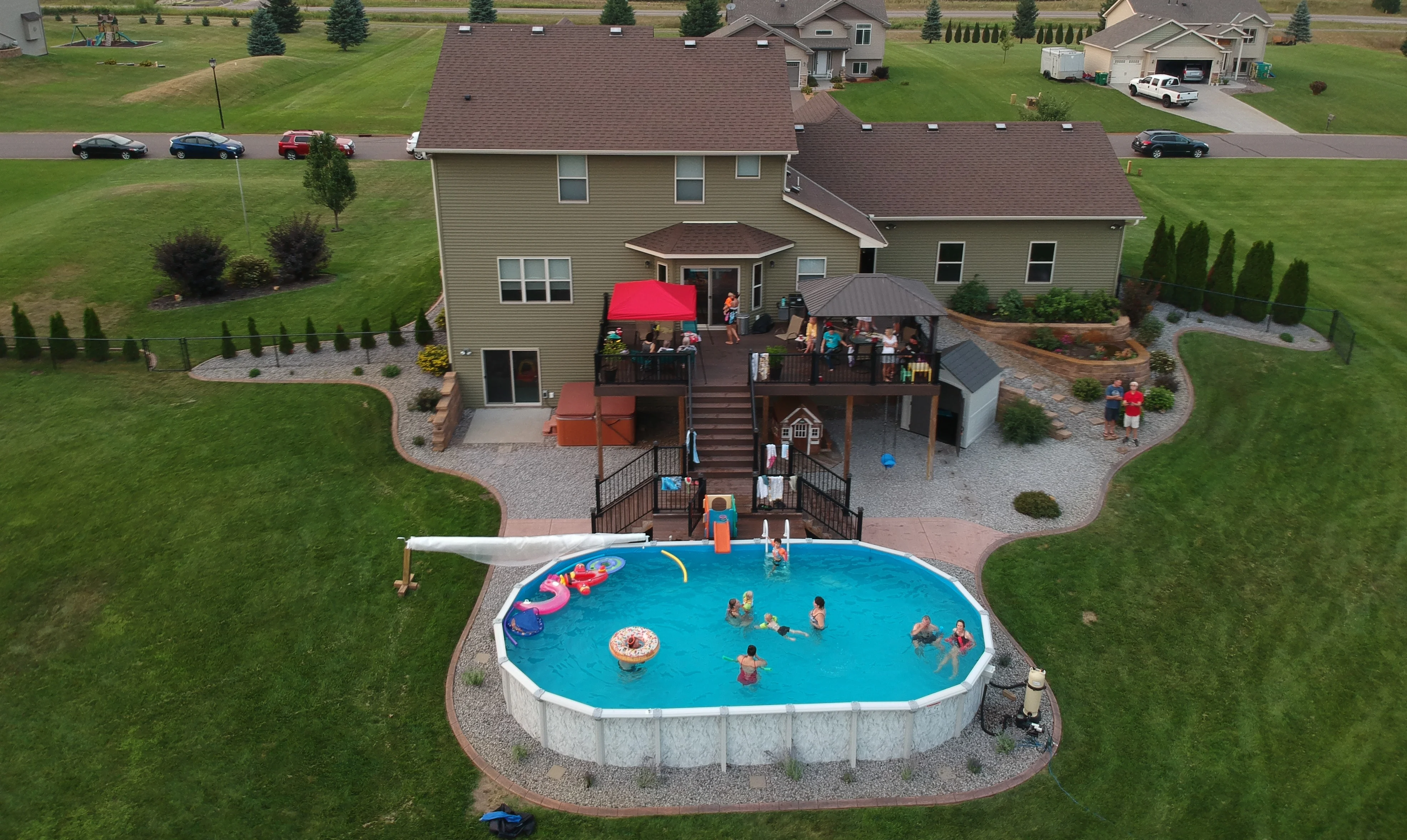 Professional pool installation team reviewing construction details and coordinating a custom swimming pool project