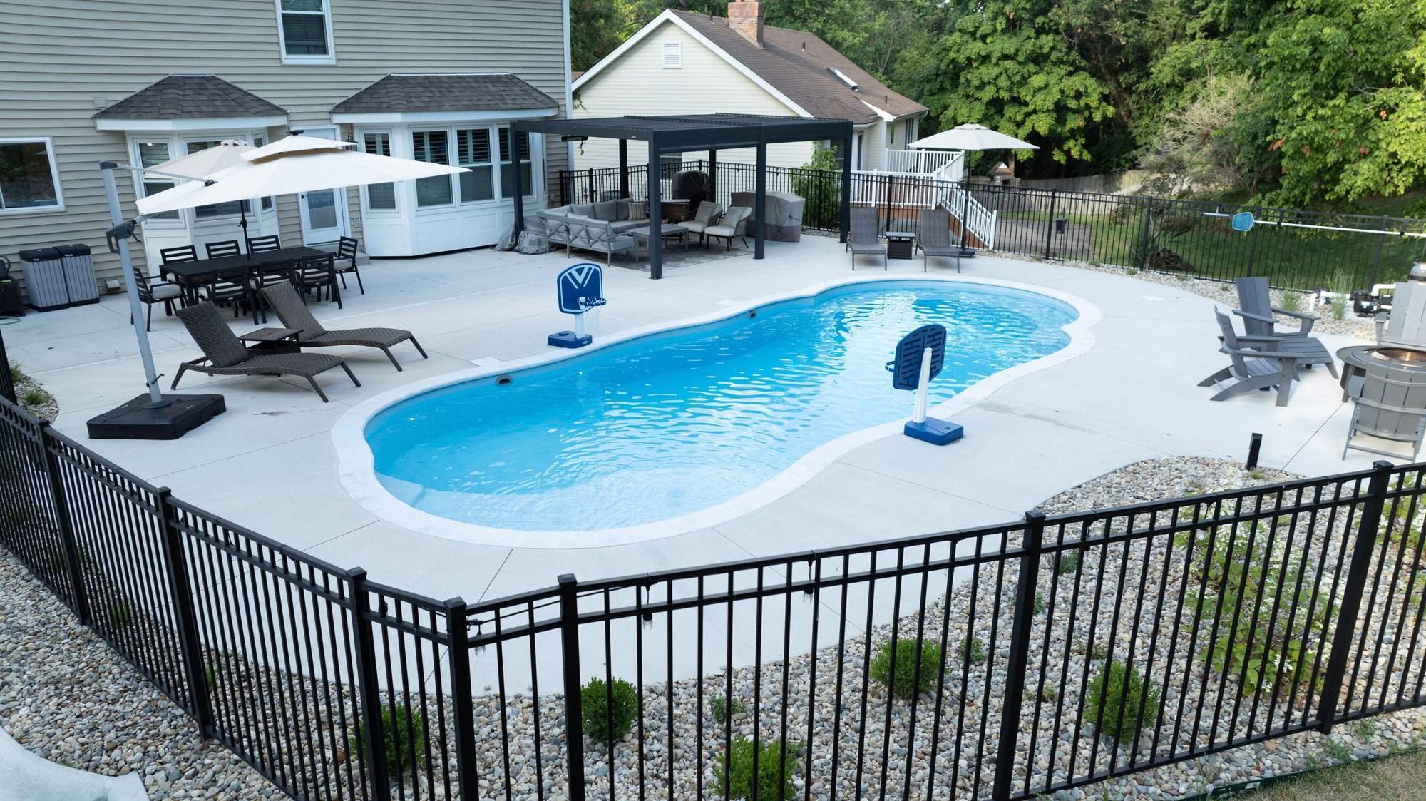 Inviting poolside relaxation area with coordinated landscaping and elegant outdoor finishes