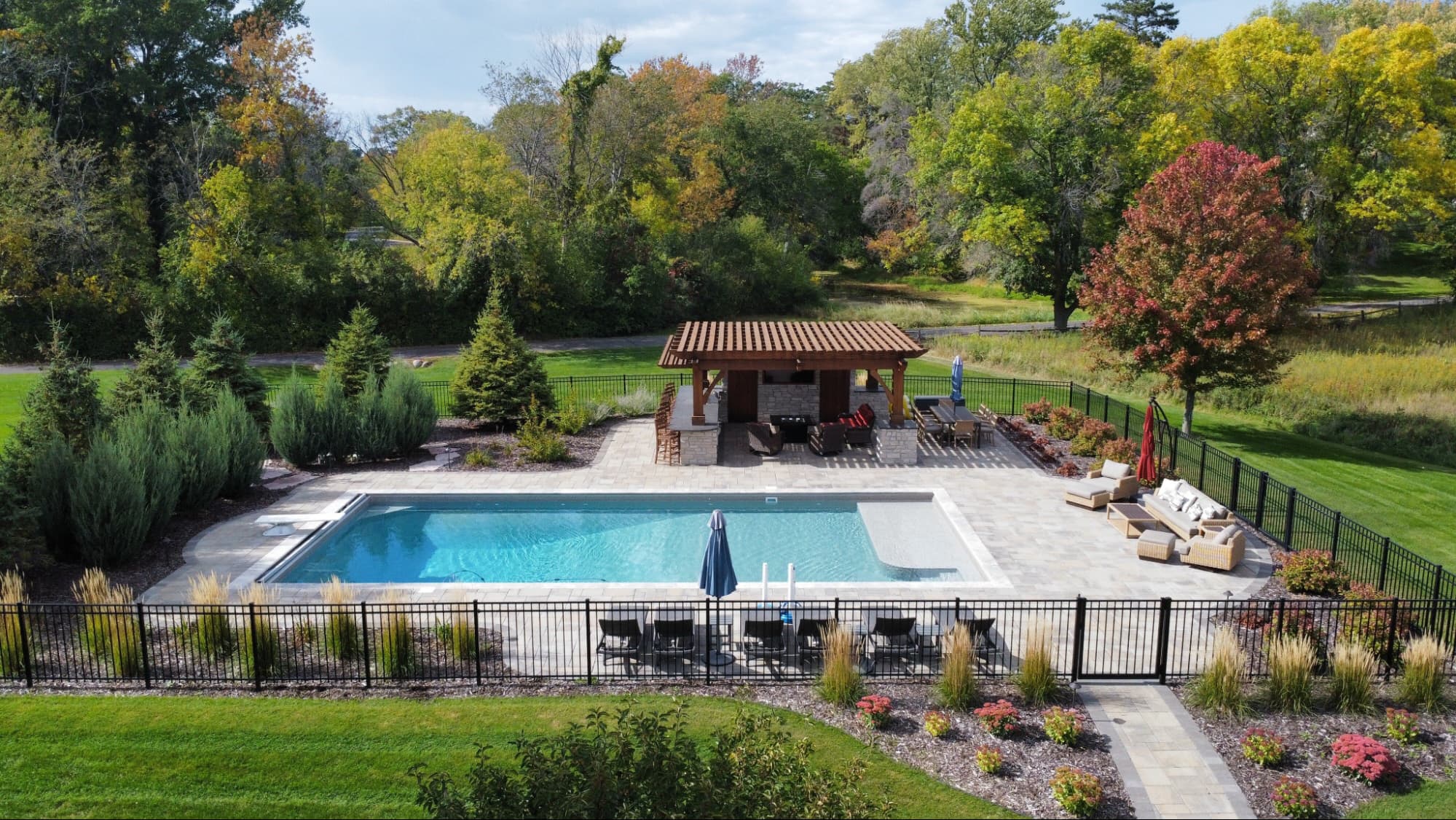 Custom in-ground swimming pool installation with carefully planned dimensions and modern architectural detailing